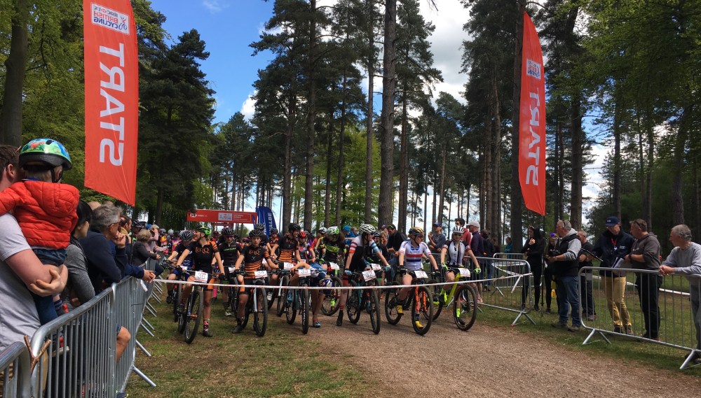 Mountain bike cross country xc racers at start line for British Cycling national event at Cannock Chase forest